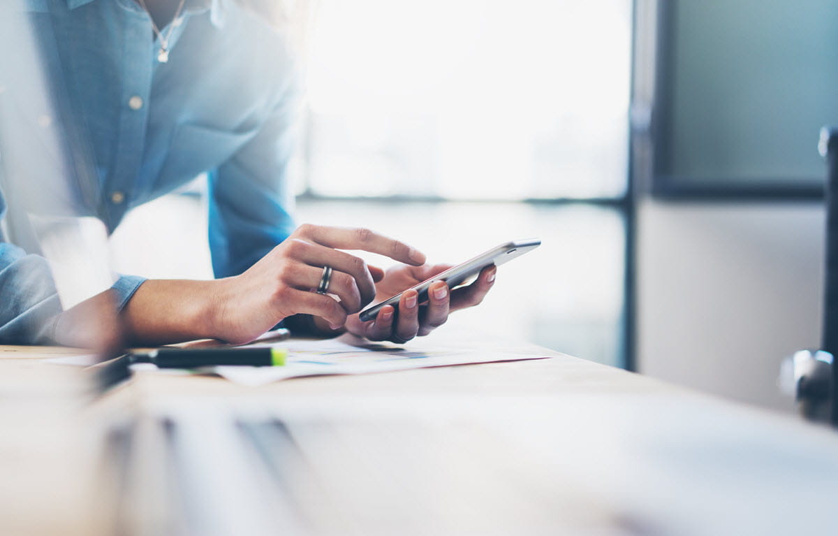 Business person using mobile phone